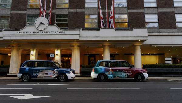 Two black cabs wrapped with Hyatt Hotel branding in front of Hyatt headquarters (London) for a PR event. (600px)