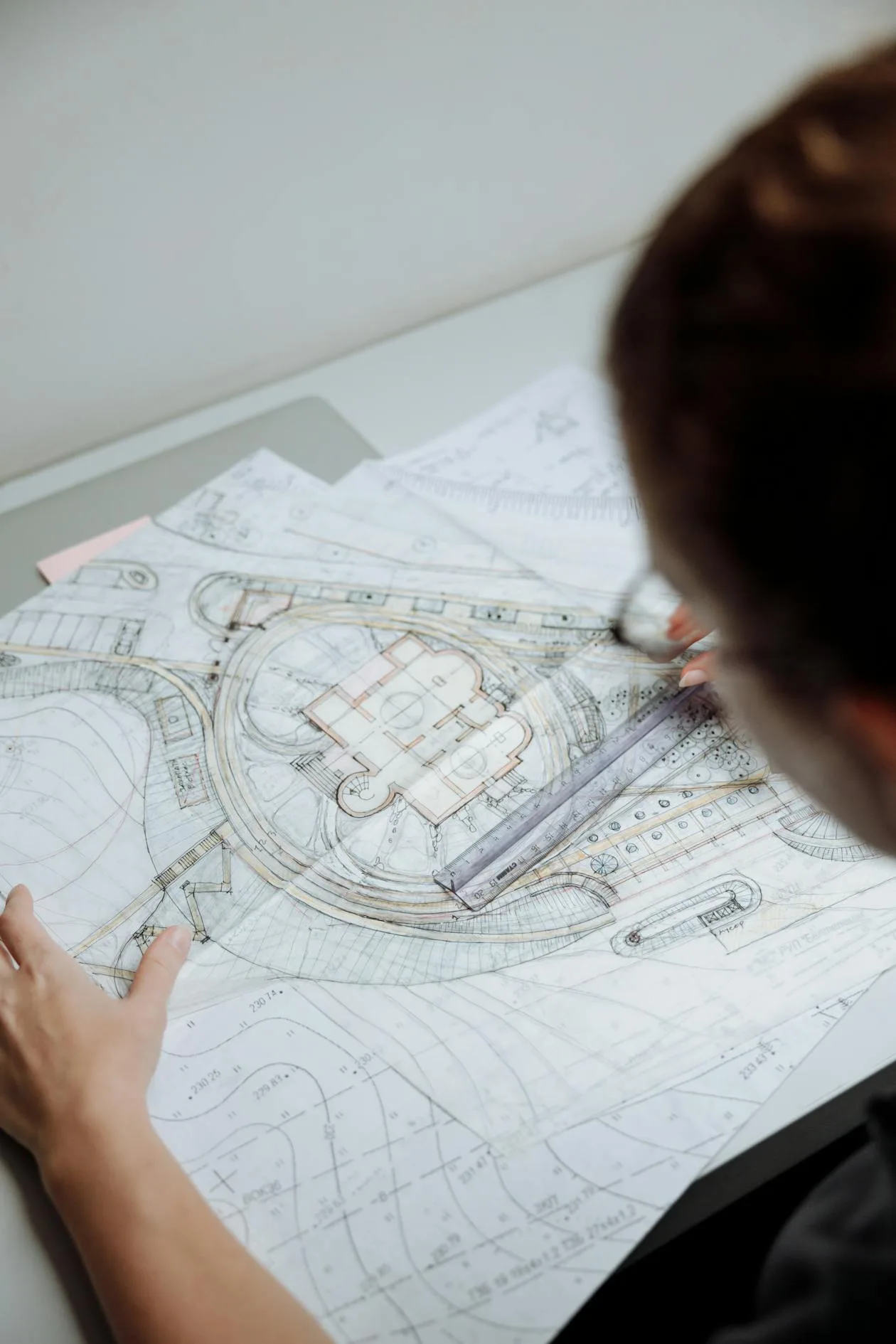 Architect reviewing blueprints — planning application drawings for advertisement consent