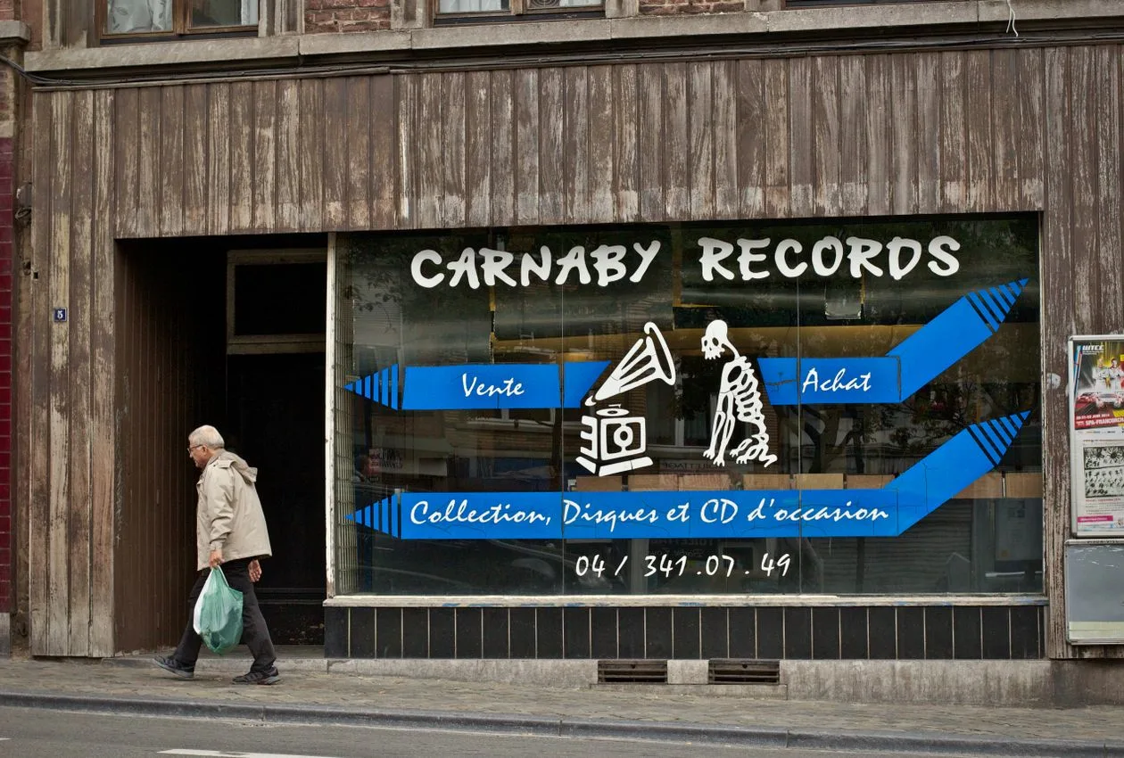 Carnaby Records shopfront in London with window graphics and retail signage on glass