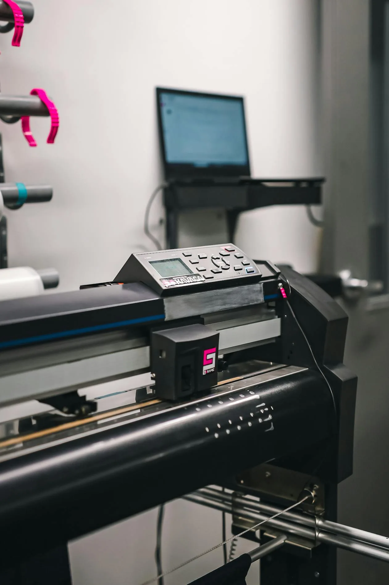 Wide format inkjet printer producing large scale print output in a professional studio