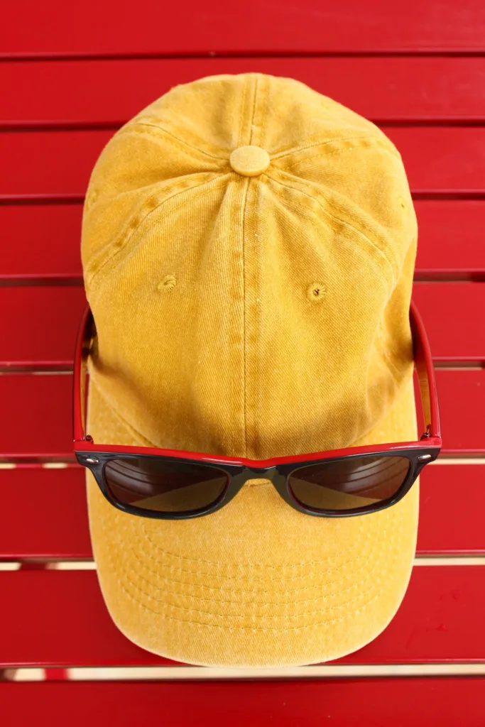 Yellow branded cap product shot