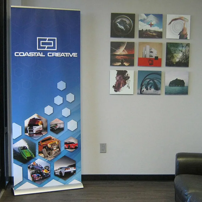 Coastal Creative roller banner pull-up stand in an office reception area