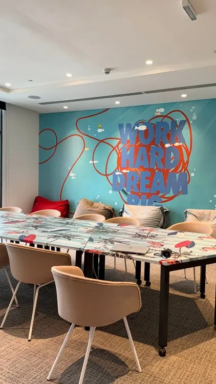 Office interior wall mural with branding