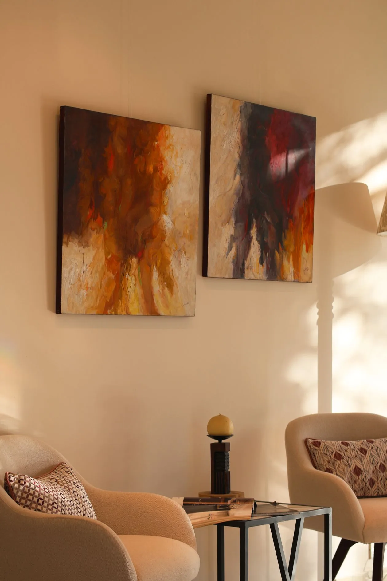 Large abstract canvas prints on a wall in a cosy living room