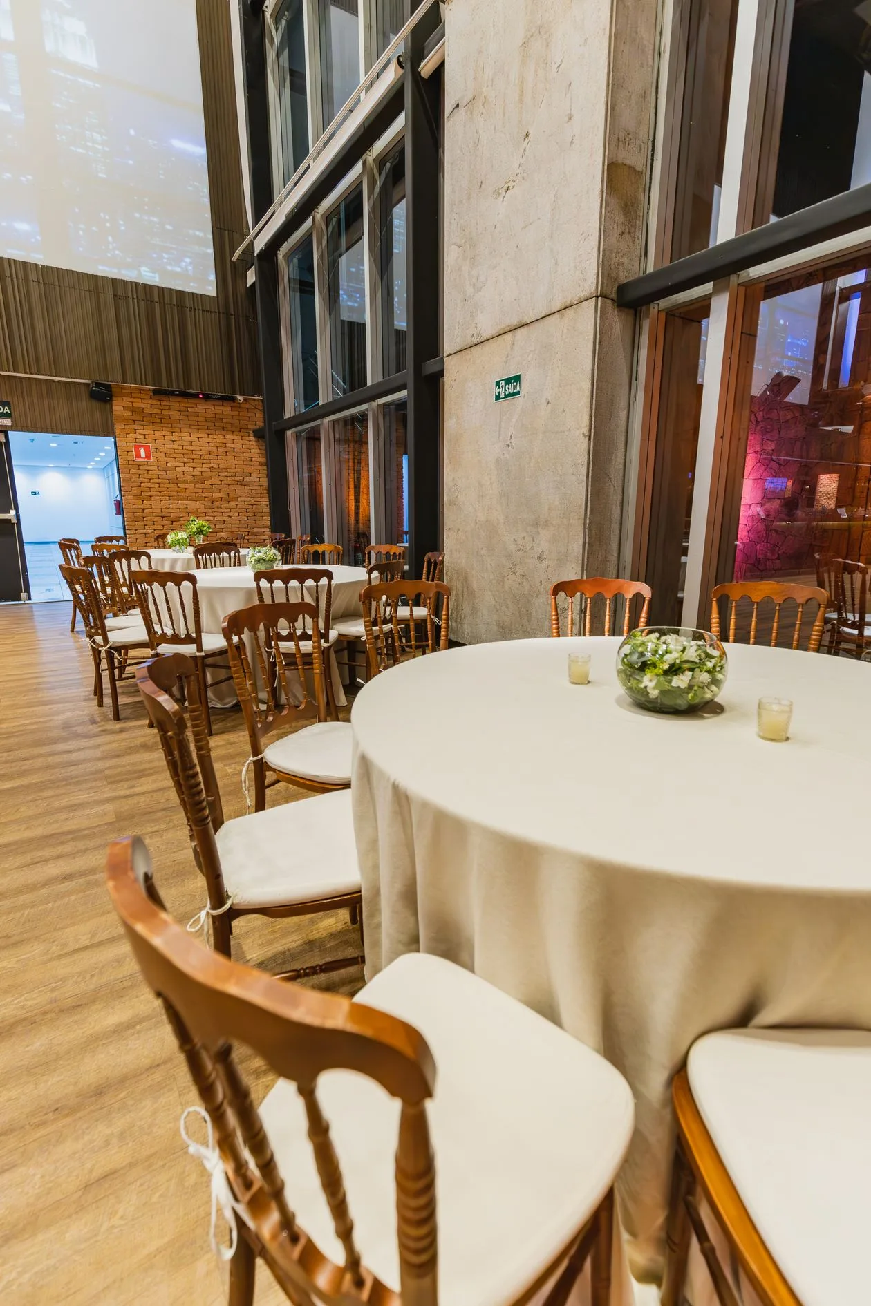 Event hall with round tables set for a fundraising dinner