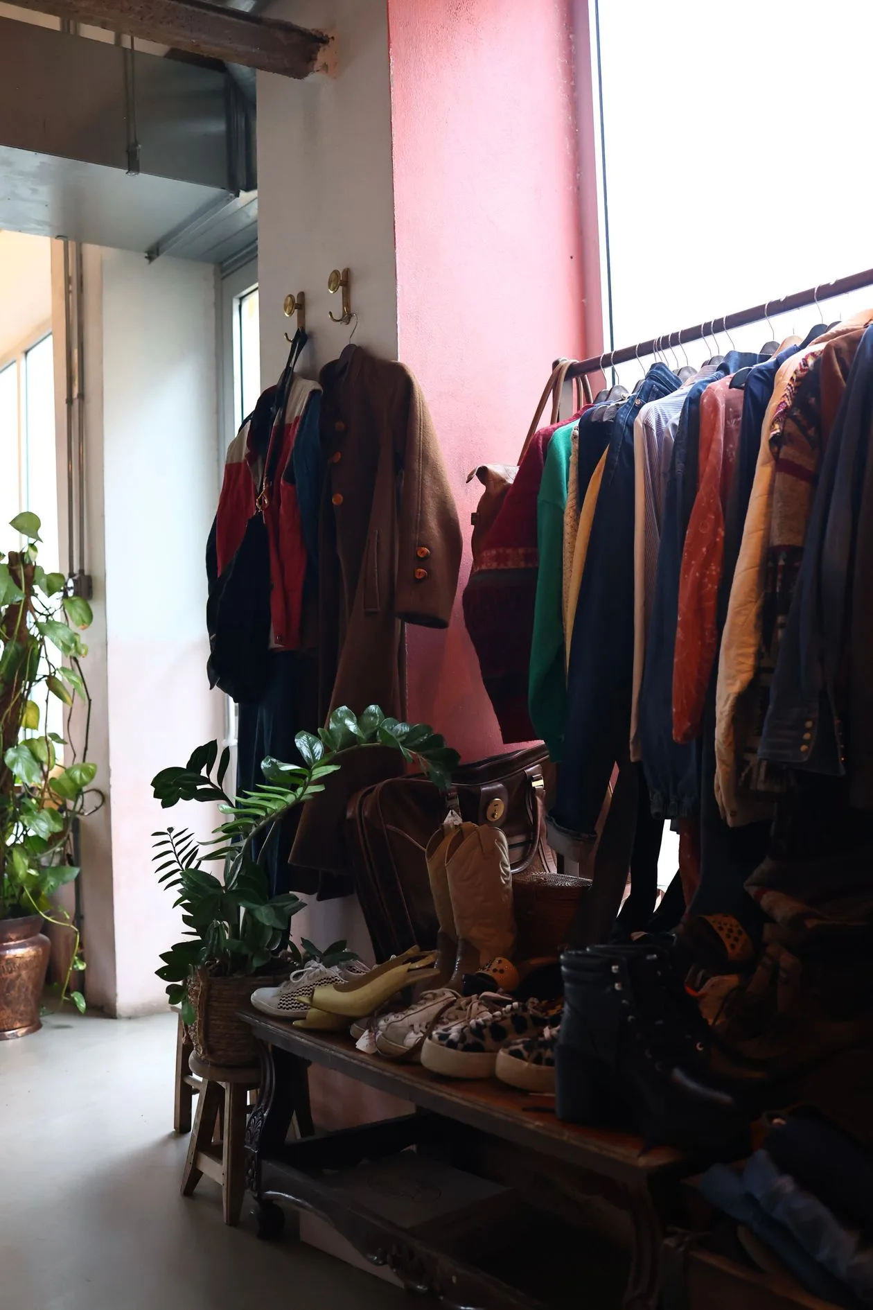 Colourful vintage clothing displayed on a shop rack