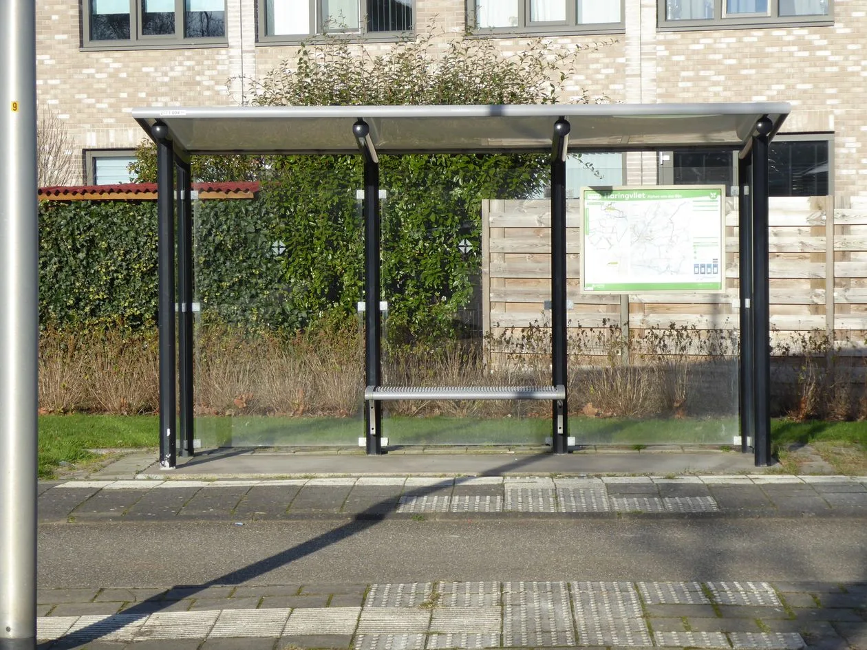 Empty modern bus shelter on a residential street