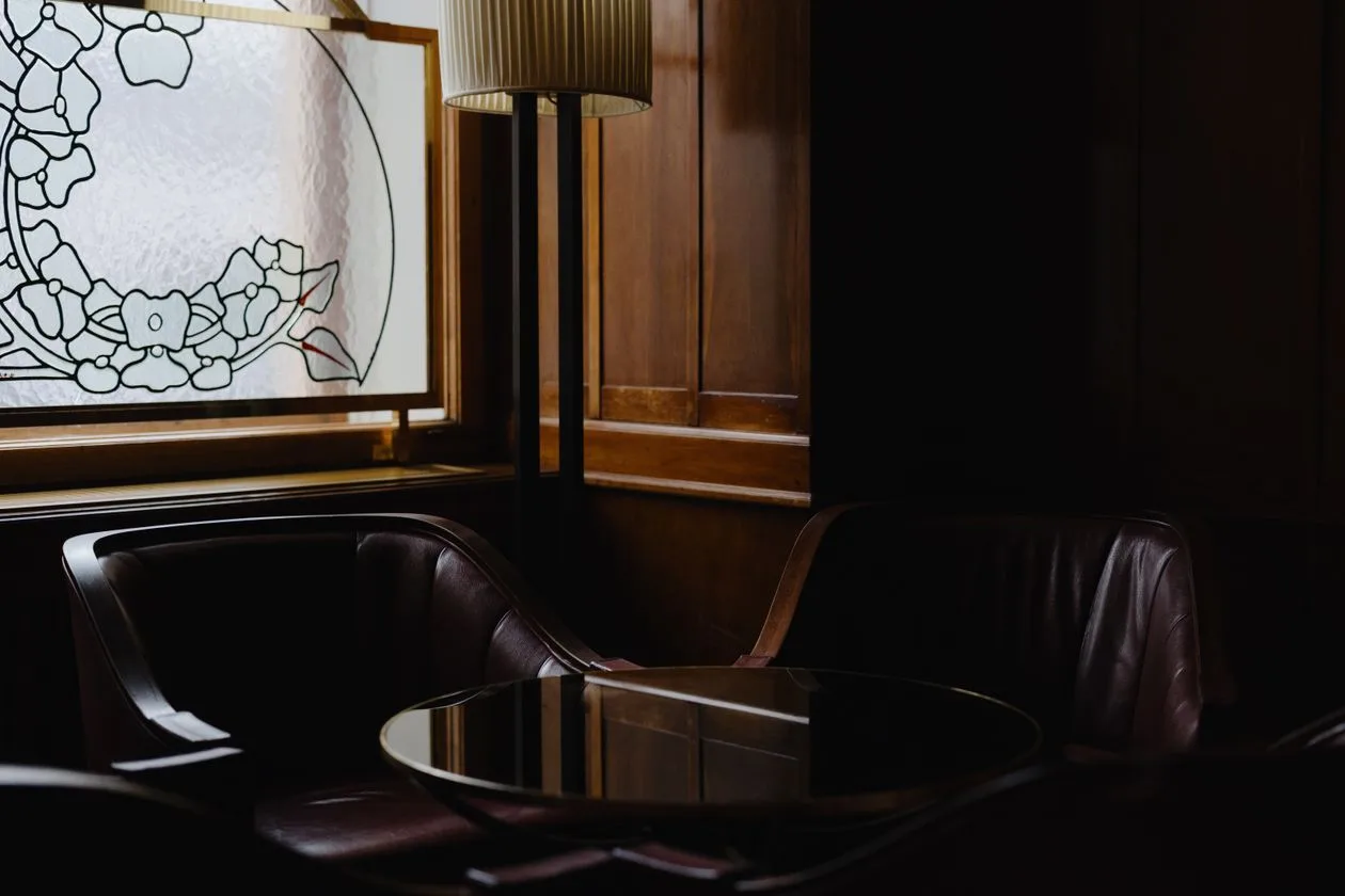 Elegant wood-panelled golf clubhouse lounge seating area