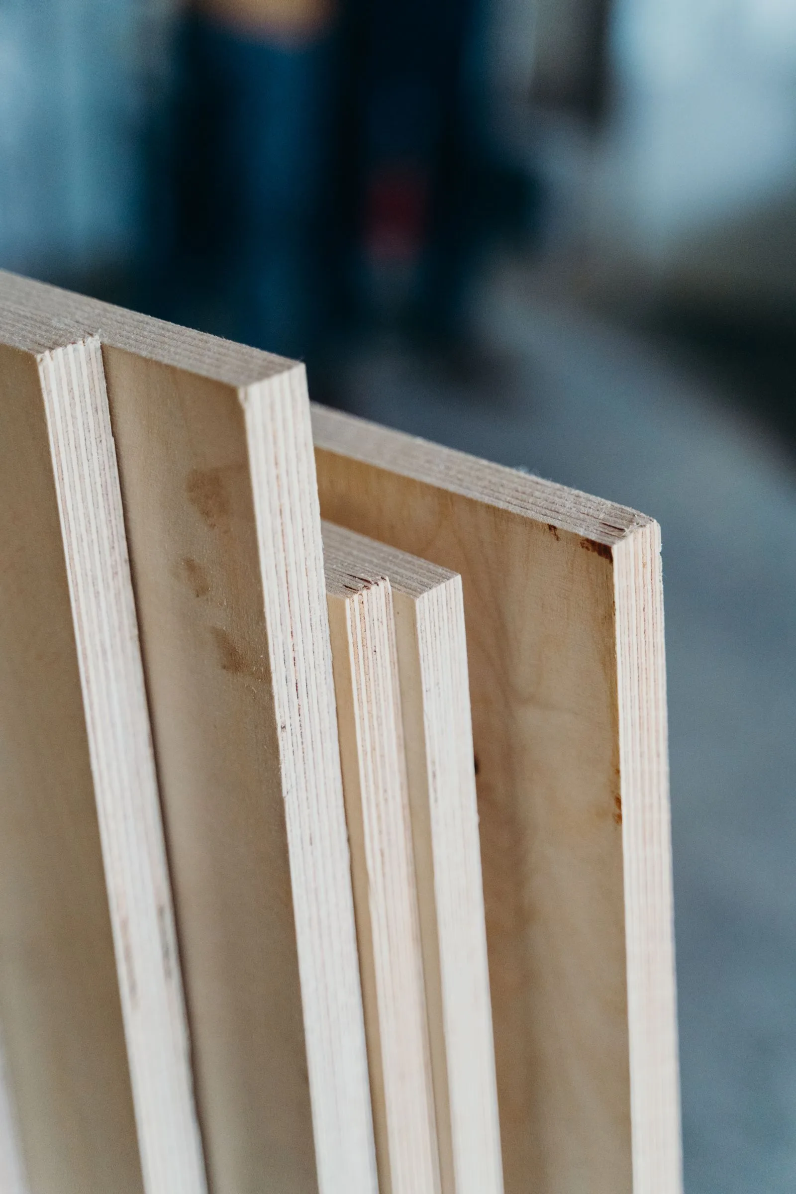 Close-up of plywood hoarding panel material showing timber grain and texture
