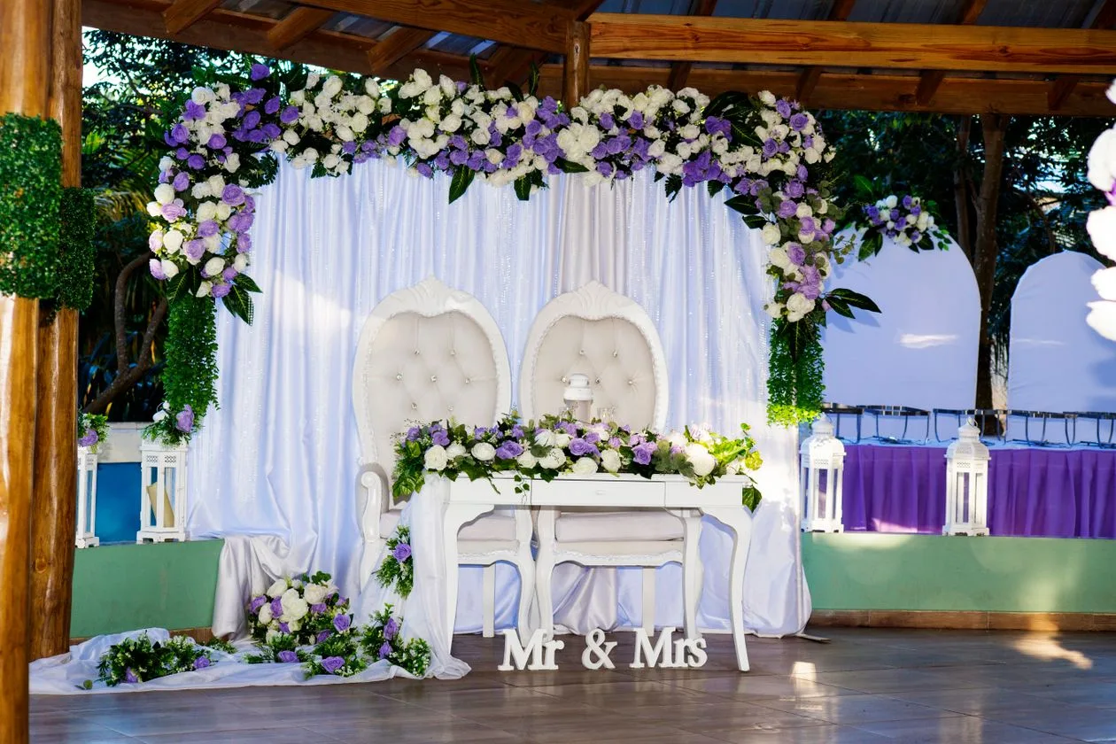 Elegant floral wedding backdrop with purple and white flowers