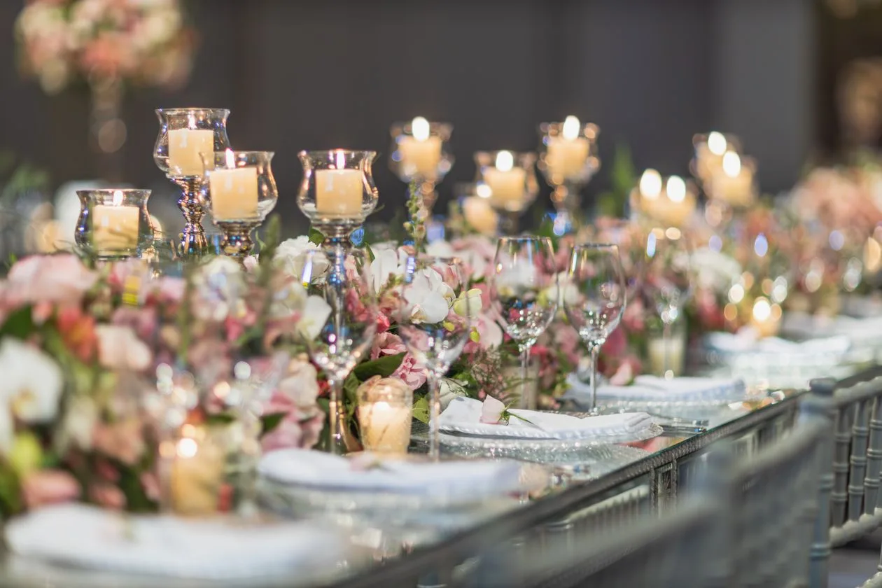 Elegant wedding table setting with candles and floral arrangements